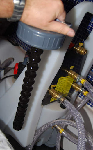 Heating specialist inspecting boiler and heating controls