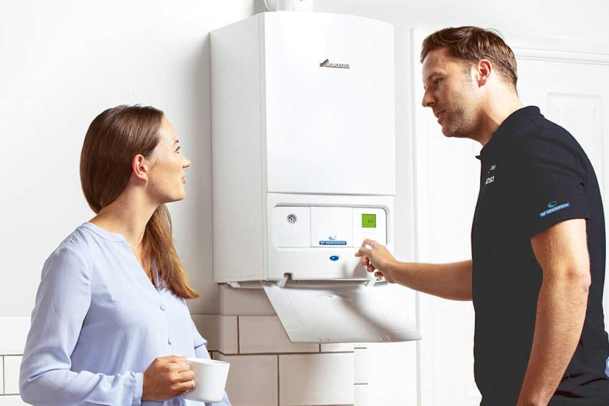 Heating engineer discussing commercial heating service